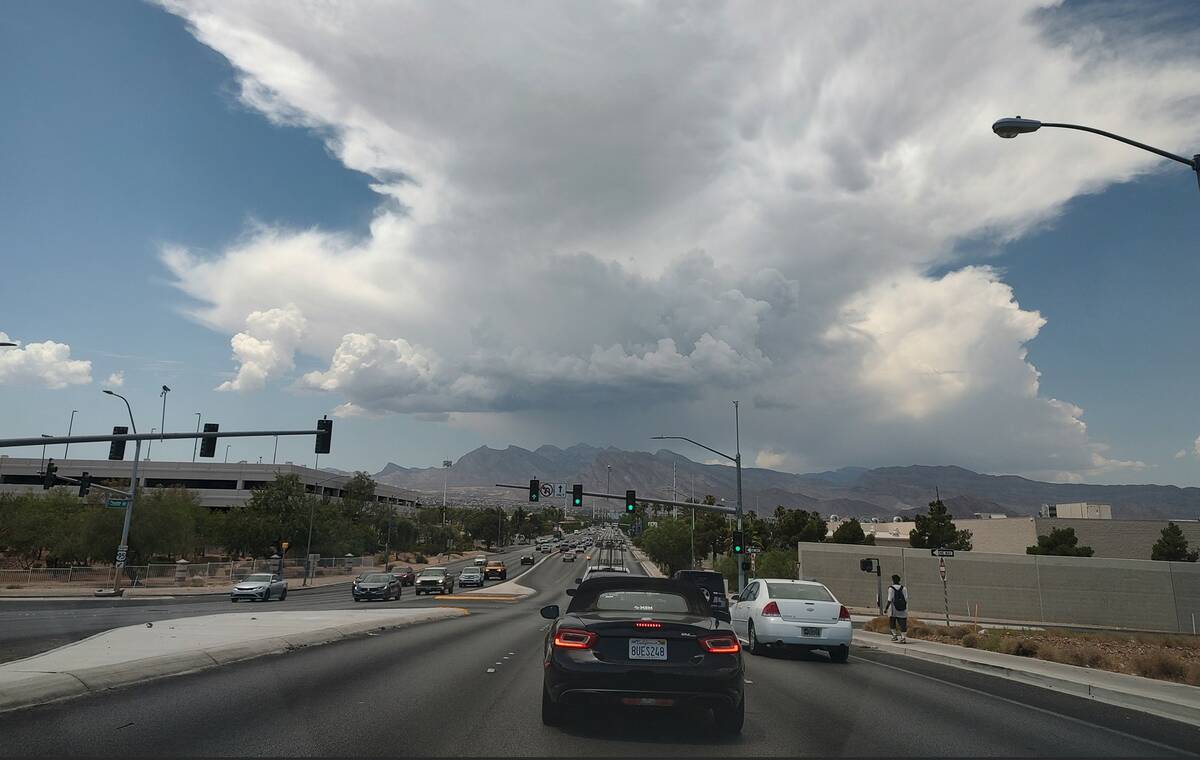 A cloud forms over the Spring Mountains stretching into central Las Vegas on Monday, July 22, 2 ...