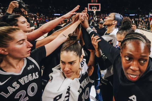 The Aces put their hands in for a team huddle after beating the Dallas Wings 104-85 during a WN ...