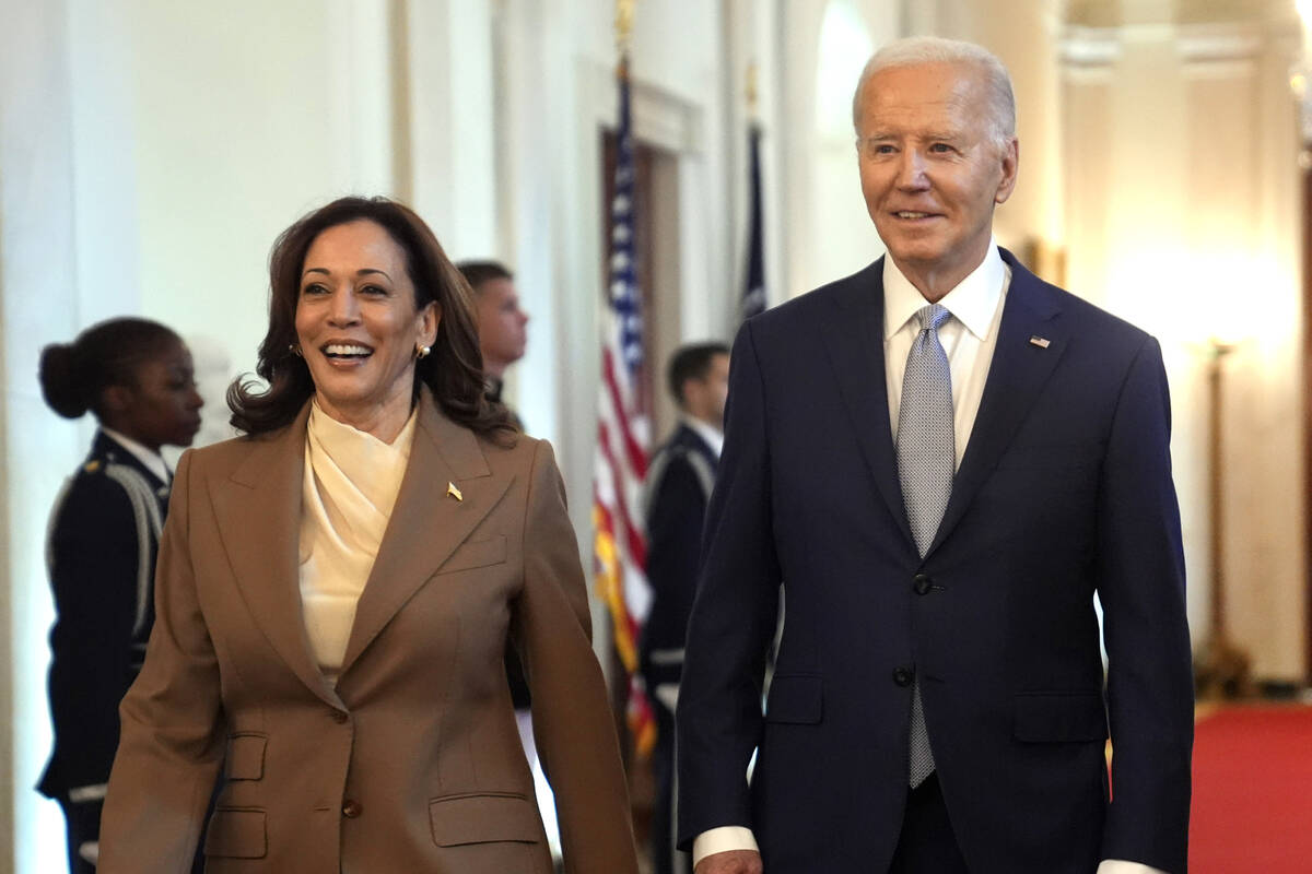 FILE - Vice President Kamala Harris, left, and President Joe Biden arrive for an event in the E ...