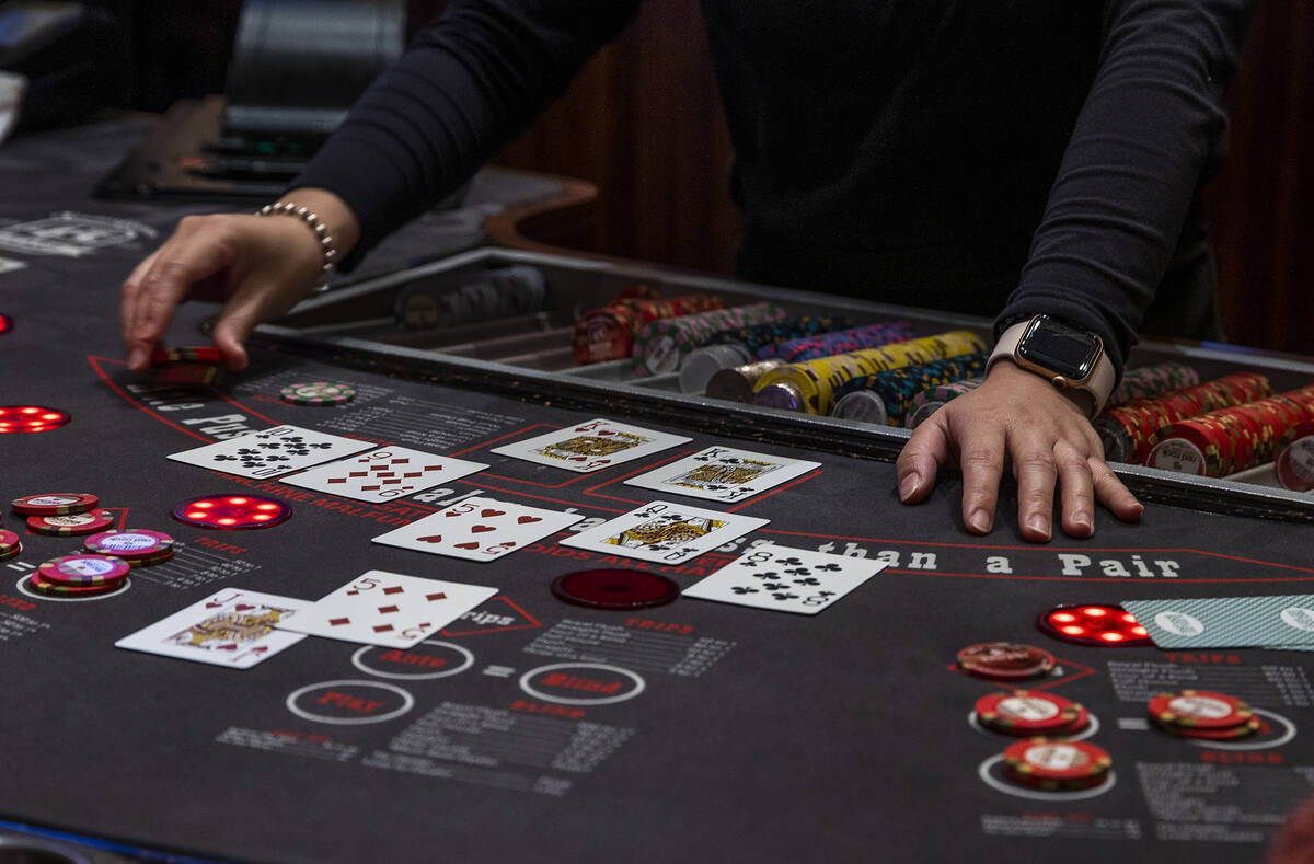 A dealer works the table as guests play Ultimate Texas Hold’Em at Red Rock Casino on Tuesday, ...