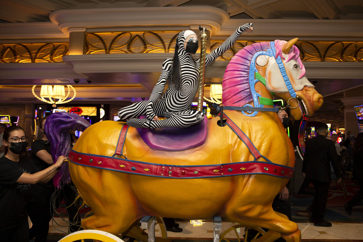 Cast members of "O" walk through Bellagio in a welcome back parade on Thursday, July ...