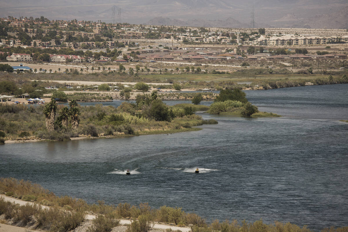 People ride on personal water crafts on the Colorado River at the southern end of Laughlin on T ...