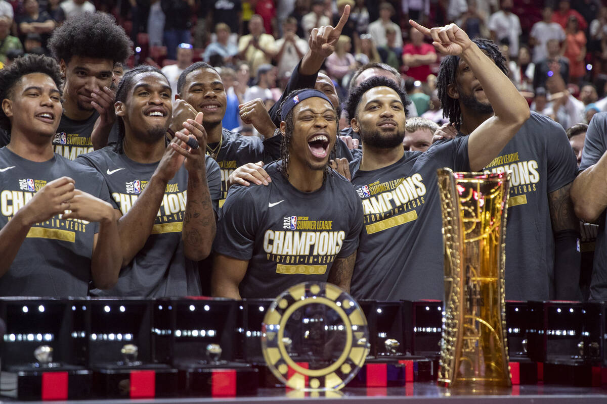 Members of the Miami Heat celebrate after defeating the Memphis Grizzlies 120-118 in overtime i ...