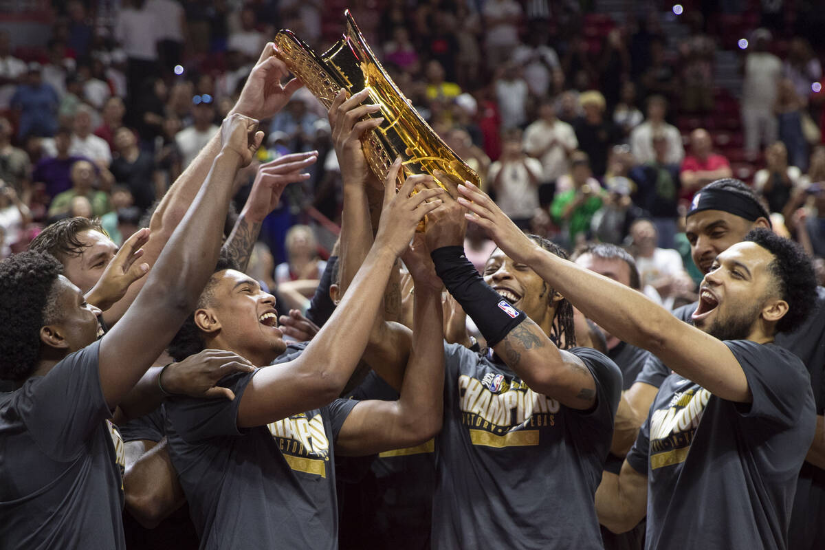 Members of the Miami Heat celebrate after defeating the Memphis Grizzlies 120-118 in overtime i ...