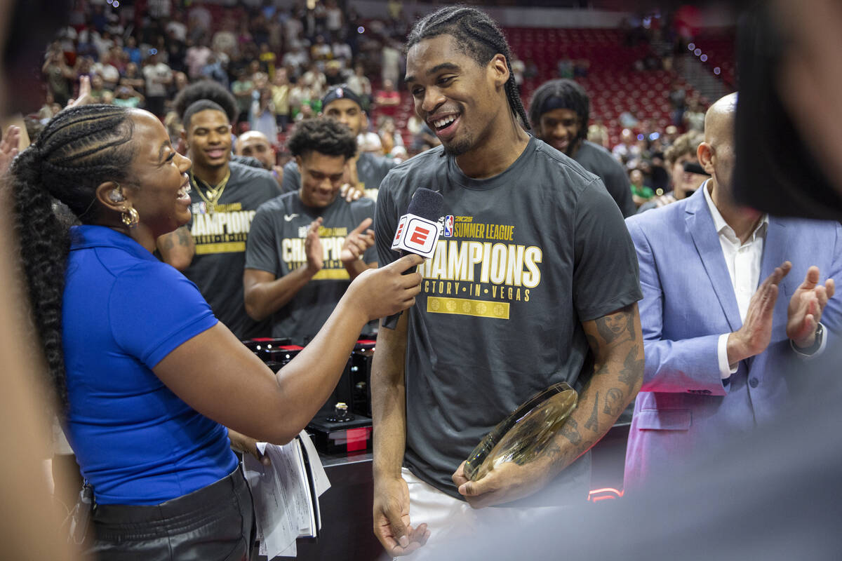 Miami Heat guard Josh Christopher, right, is interviewed after being named the most valuable pl ...