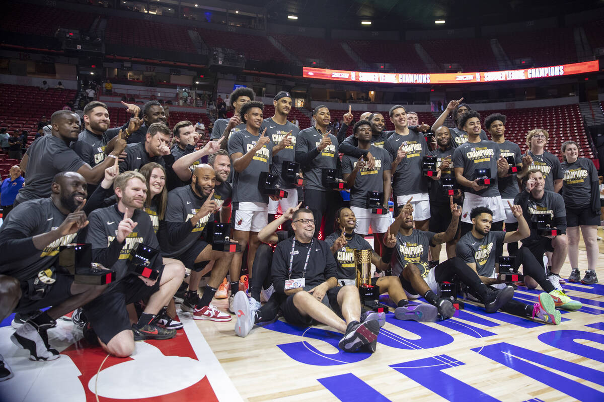 Members of the Miami Heat celebrate after defeating the Memphis Grizzlies 120-118 in overtime i ...