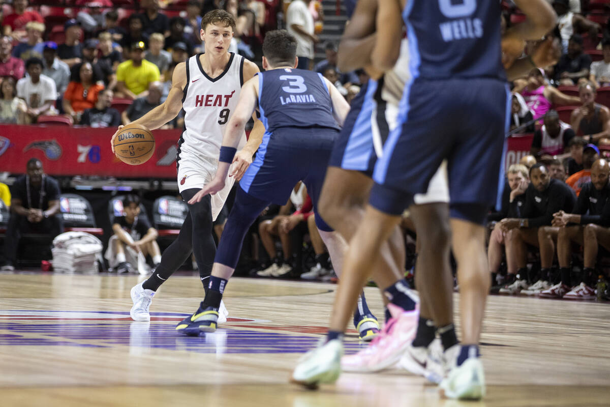 Miami Heat guard Pelle Larsson (9) looks to make a play against Memphis Grizzlies forward Jake ...