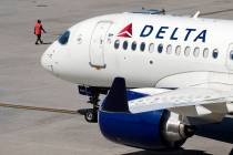 FILE - A Delta Air Lines jet leaves the gate, Friday, July 19, 2024, at Logan International Air ...