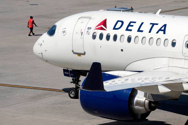 FILE - A Delta Air Lines jet leaves the gate, Friday, July 19, 2024, at Logan International Air ...