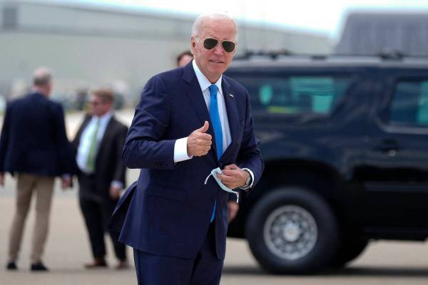President Joe Biden arrives to board Air Force One at Dover Air Force Base, in Dover, Del., Tue ...