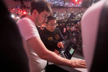 Jonathan Tamayo, right, talks to Dominik Nitsche while competing in the final table of the Worl ...
