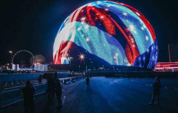 Spectators watch the Sphere on Thursday, July 4, 2024, in Las Vegas. (Madeline Carter/Las Vegas ...