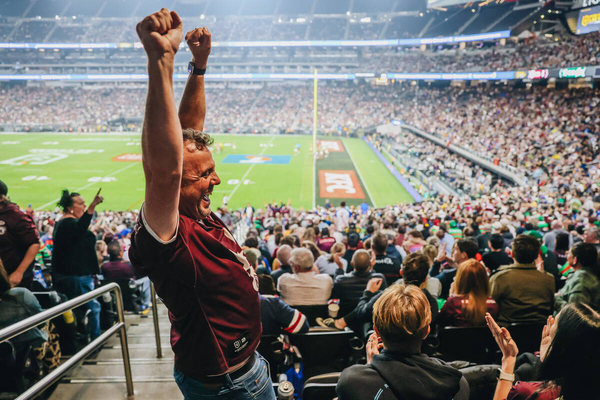 A Sea Eagles fan celebrates a try during a rugby match between the Sea Eagles and Rabbitohs at ...