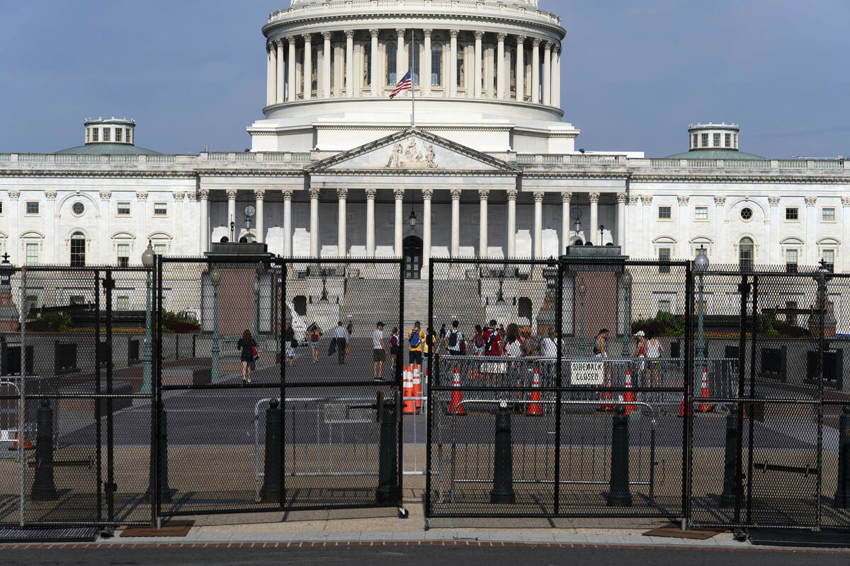 The U.S. Capitol is seen behind a security fence a day before of Israel's Prime Minister Benjam ...