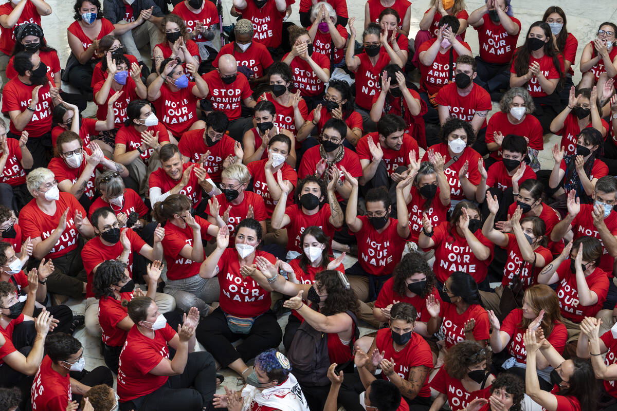 Demonstrators protest against the military policies of Israel a day before a visit by Israeli P ...