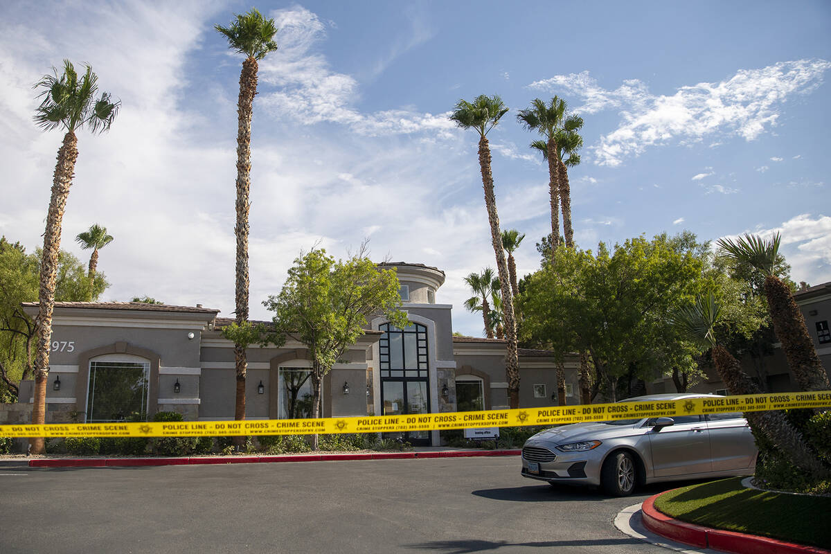 Police tape blocks the leasing office at The Clubs at Rhodes Ranch, Tuesday, July 23, 2024, in ...