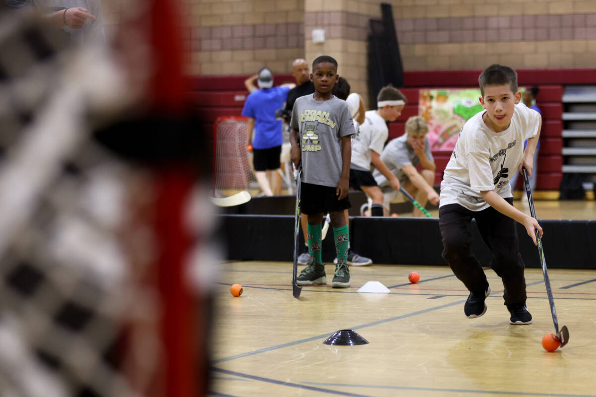 Local kids participate in a street hockey camp at the Veterans Memorial Community Center on Tue ...