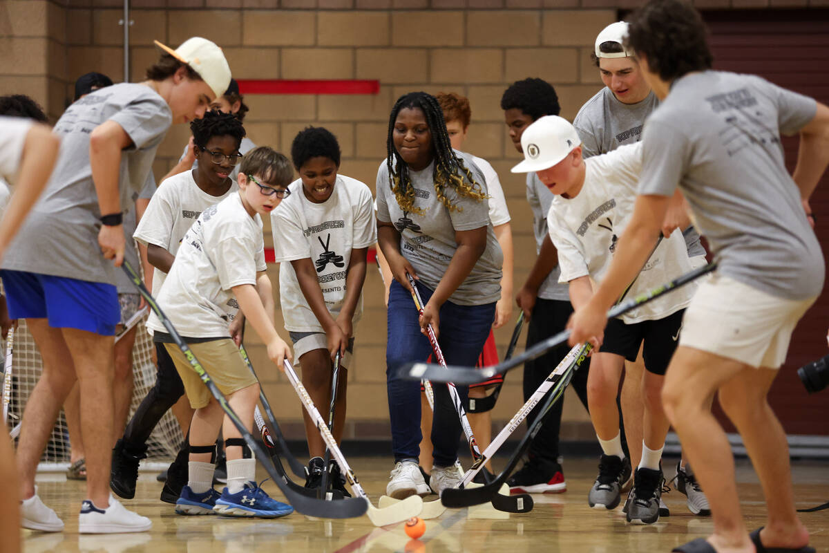 Local kids participate in a street hockey camp at the Veterans Memorial Community Center on Tue ...