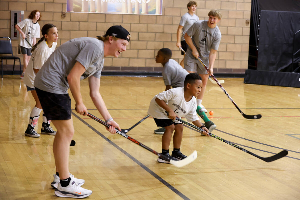 Local kids participate in a street hockey camp at the Veterans Memorial Community Center on Tue ...