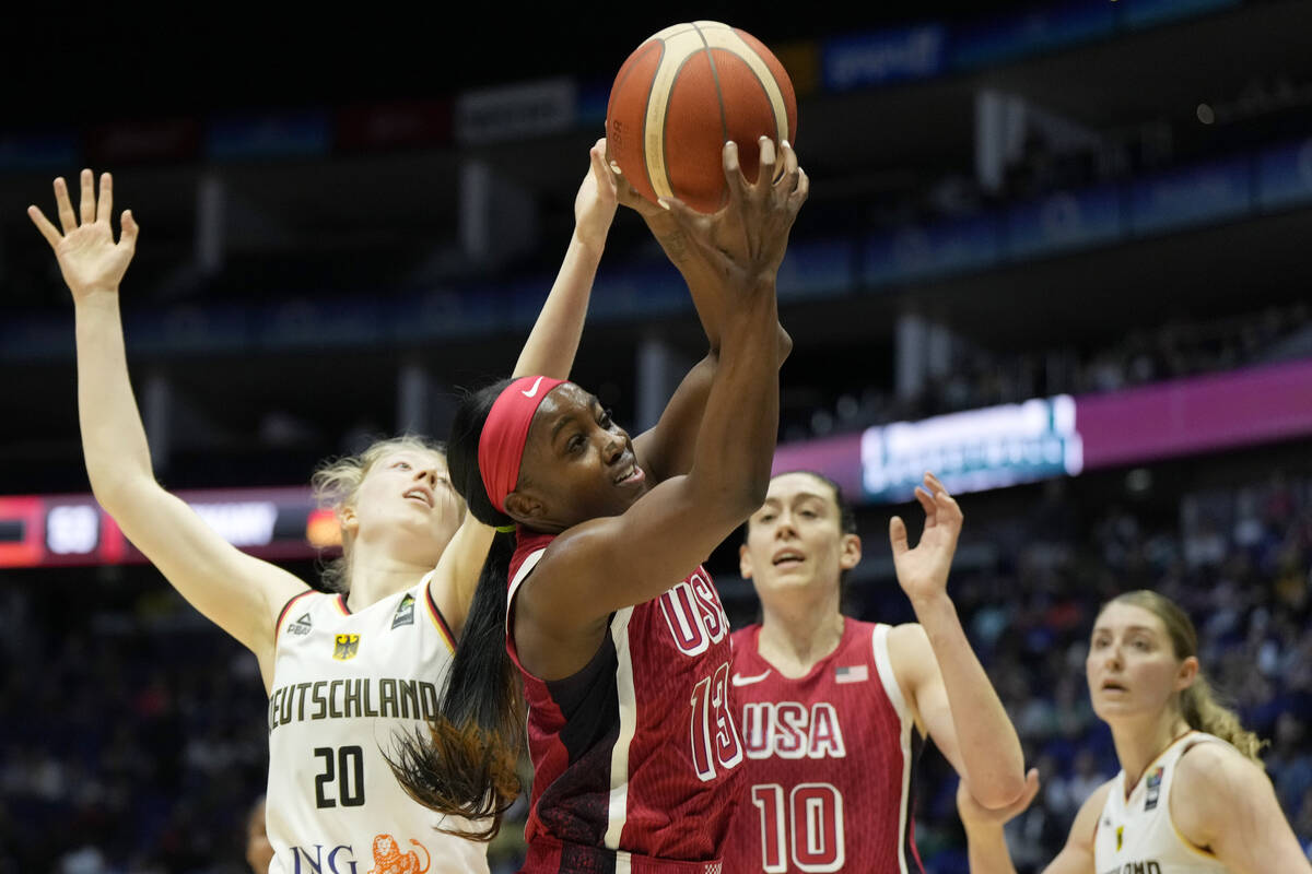 United States' Jackie Young catches the ball during a women's exhibition basketball game betwee ...