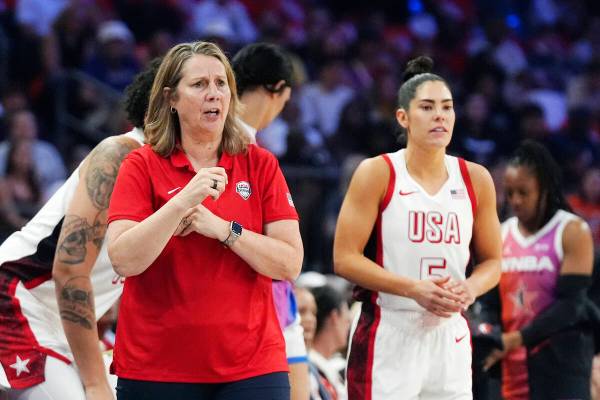 Cheryl Reeve, left, head coach of Team USA, shouts instructions to players as Kelsey Plum, righ ...