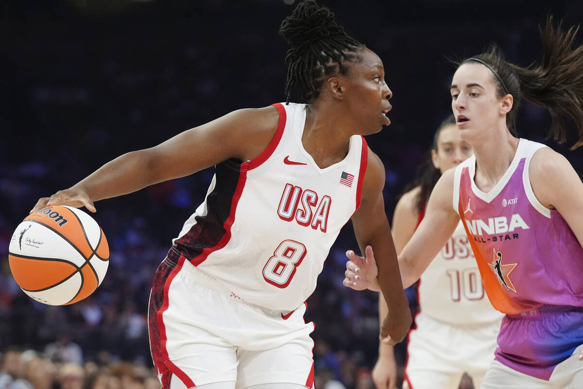 Chelsea Gray (8), of Team USA, dribbles the ball against Caitlin Clark, of Team WNBA, during th ...