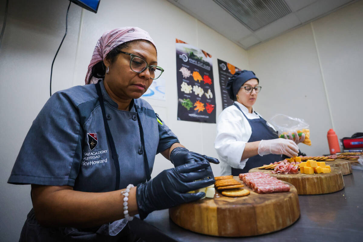 Letrice “Trice” Howard makes charcuterie boards with her students at the Culinary Academy o ...