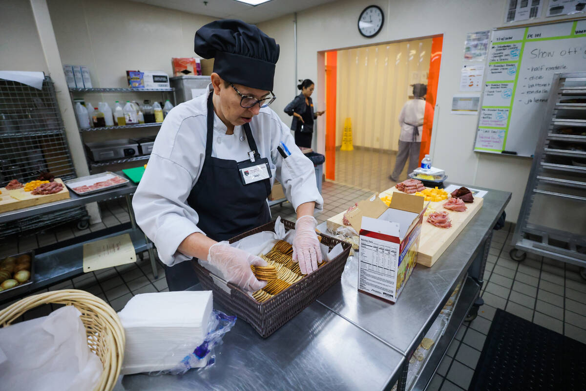 A student organizes crackers at the Culinary Academy of Las Vegas on Friday, July 19, 2024, in ...