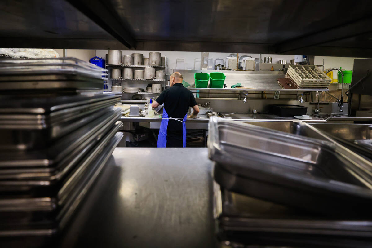 A student washes dishes at the Culinary Academy of Las Vegas on Friday, July 19, 2024, in North ...