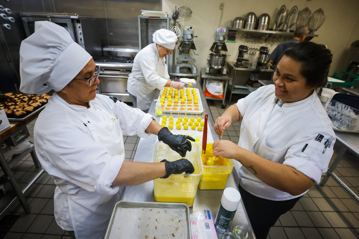 Students decorate sweets at the Culinary Academy of Las Vegas on Friday, July 19, 2024, in Nort ...