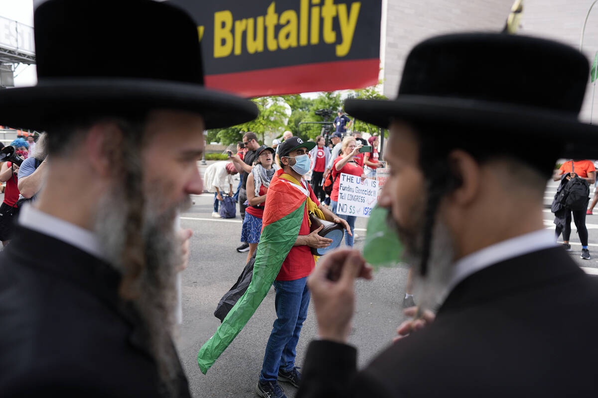 Hasidic Jews and others protest Israeli Prime Minister Benjamin Netanyahu's polices, near the U ...