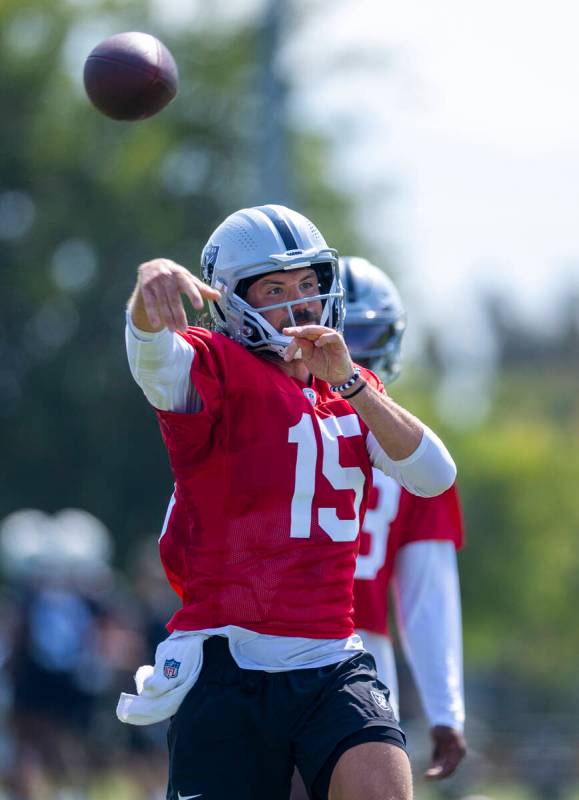 Raiders quarterback Gardner Minshew (15) passes the ball during the first day of training camp ...