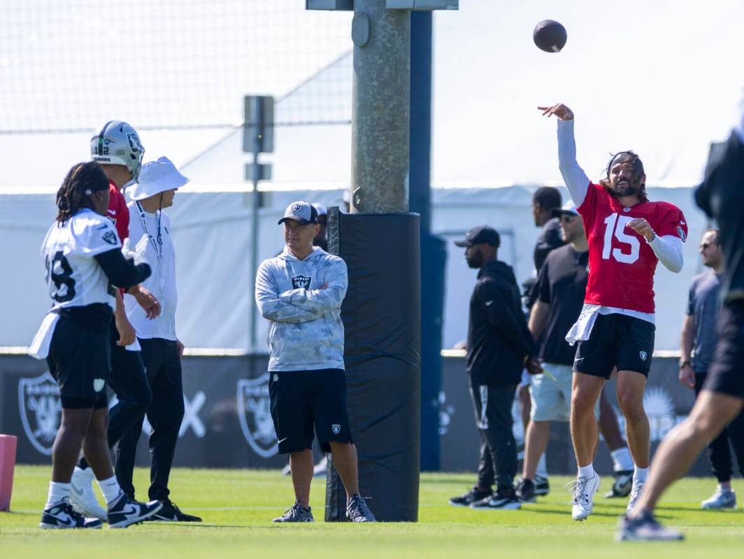 Raiders quarterback Gardner Minshew (15) tosses a ball during the first day of training camp at ...