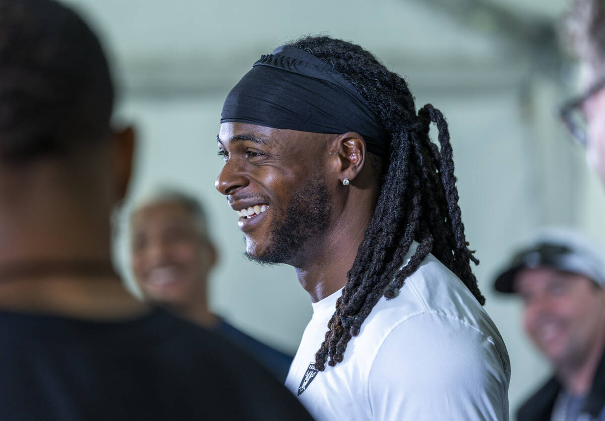 Raiders Wide Receiver Davante Adams (17) laughs at a question during a media interview on the f ...