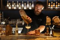 Mixologist Cody Fredrickson pours at Las Vegas Distillery in Henderson. The distillery reopened ...