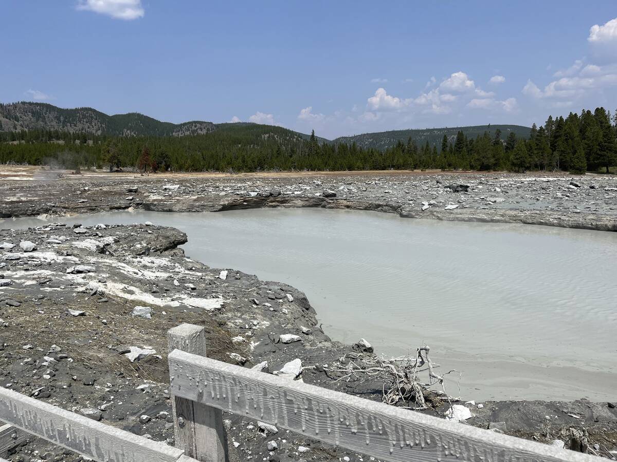 In this photo released by the National Park Service, debris litter the damaged Biscuit Basin bo ...