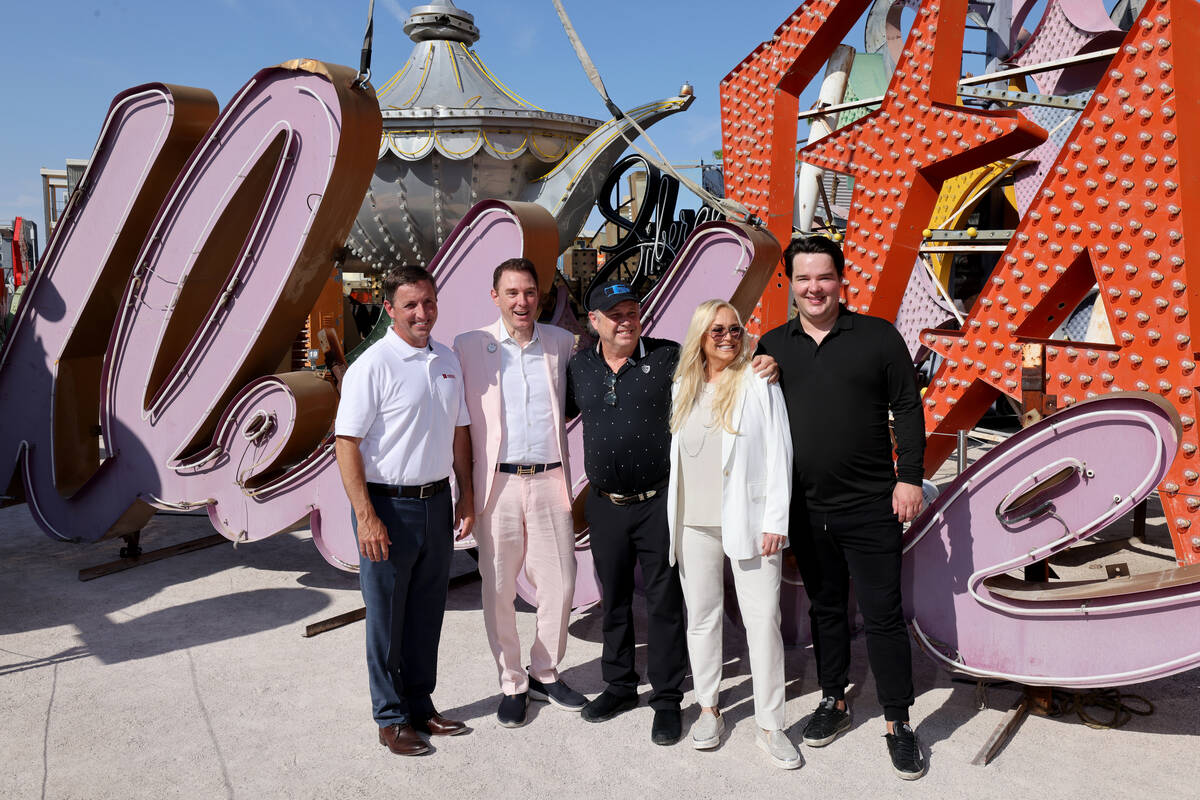 YESCO sign company Executive Vice President Jeff Young, from left, Neon Museum Executive Direct ...