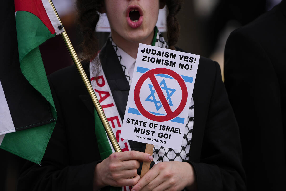 A demonstrator protesting near the Capitol during Israeli Prime Minister Benjamin Netanyahu's v ...
