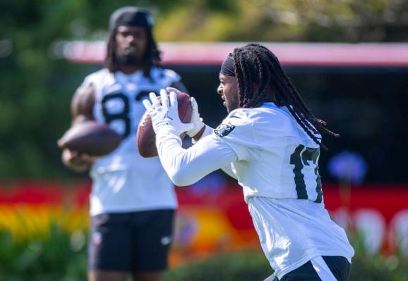 Raiders wide receiver Davante Adams (17) catches a pass during the first day of training camp a ...
