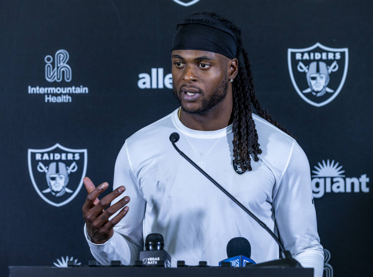 Raiders wide receiver Davante Adams (17) answers a question during a media interview on the fir ...