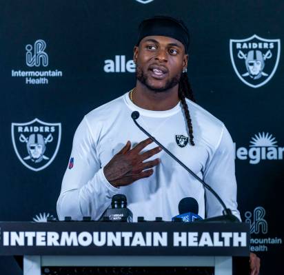 Raiders wide receiver Davante Adams (17) answers a question during a media interview on the fir ...