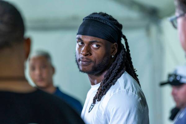 Raiders wide receiver Davante Adams (17) listens to a question during a media interview on the ...