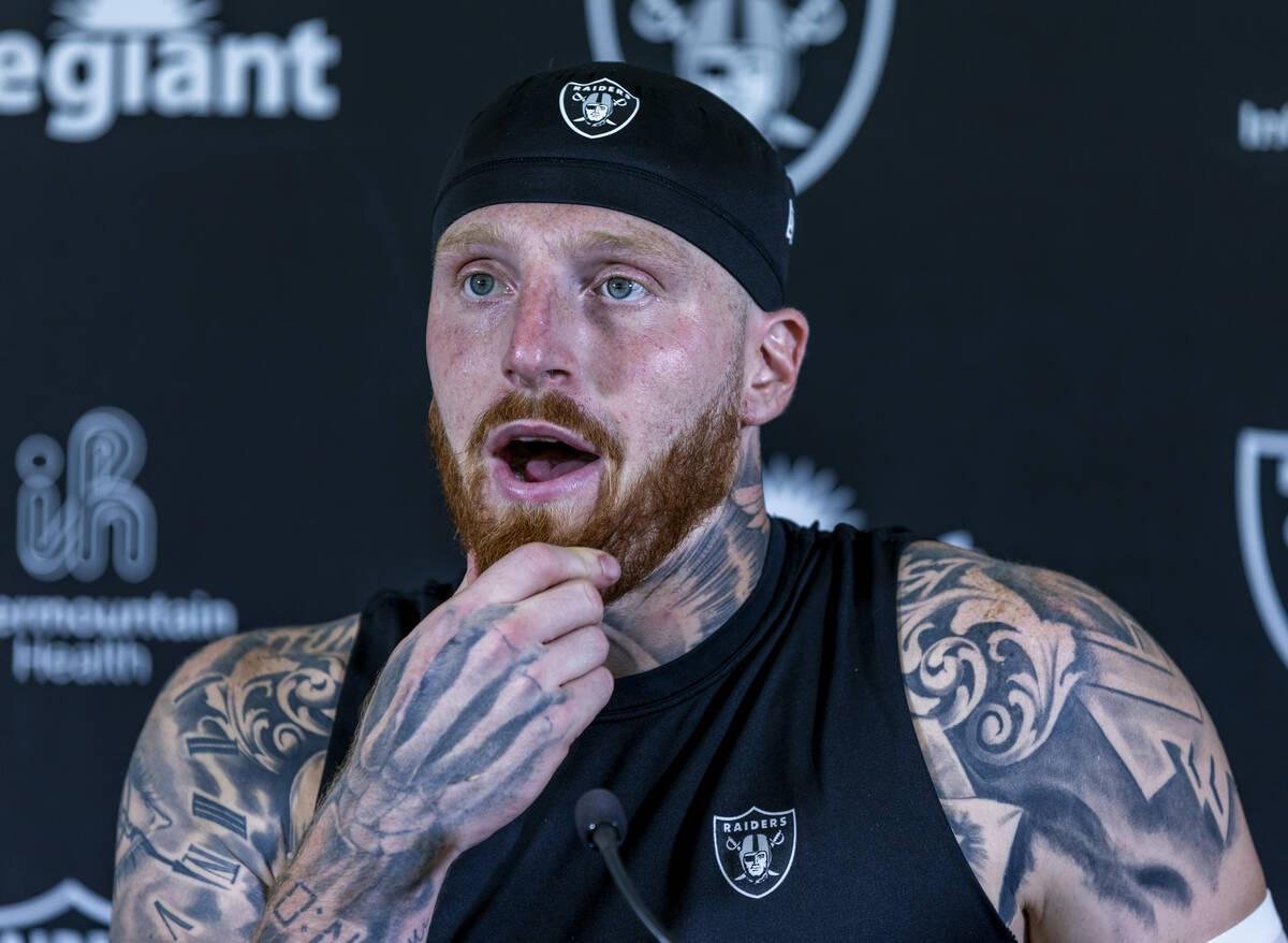 Raiders defensive end Maxx Crosby (98) considers a response during a media interview on the fir ...