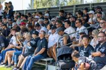 Raiders fans watch players practice during the first day of training camp at the Jack Hammett S ...