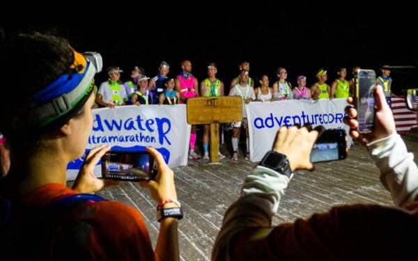 Runners line up for a photo at Badwater Basin, the lowest elevation point in North America, dur ...