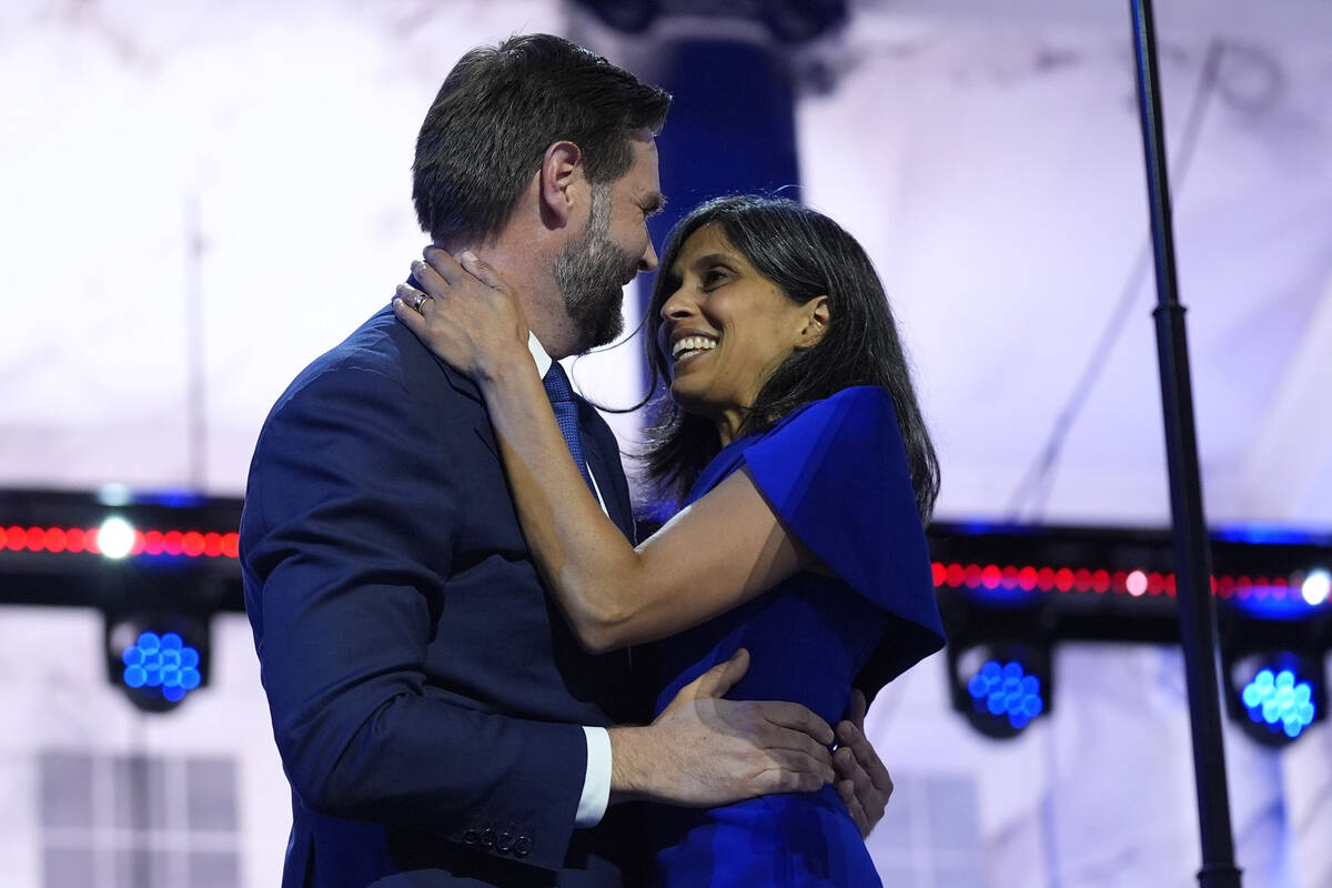 Republican vice presidential candidate Sen. JD Vance, R-Ohio, hugs his wife Usha Chilukuri Vanc ...