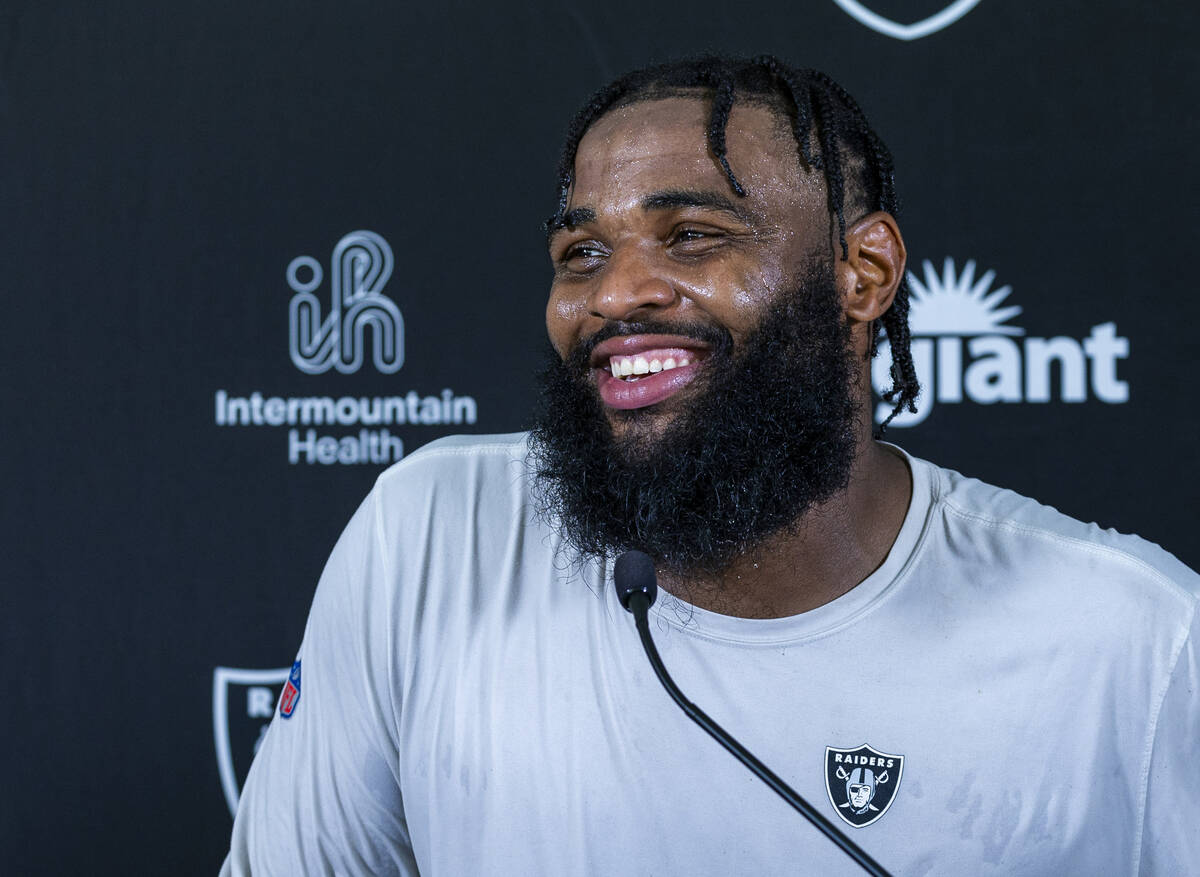Raiders defensive tackle Christian Wilkins (94) laughs at a question during a media interview o ...