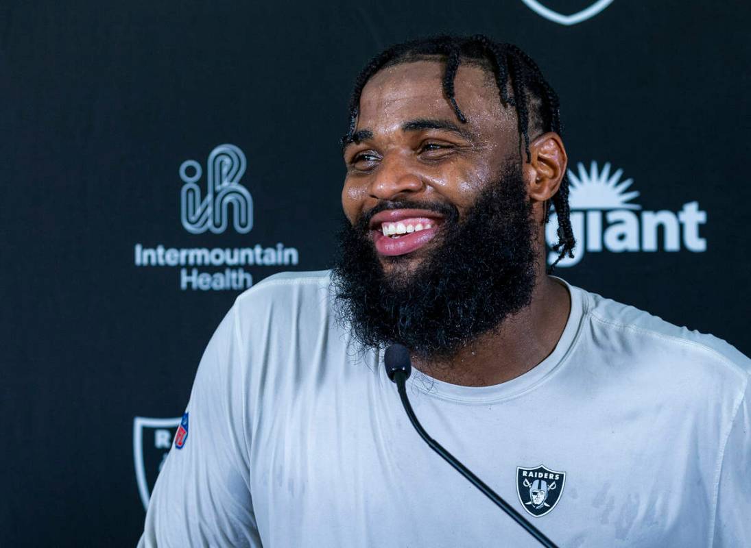 Raiders defensive tackle Christian Wilkins (94) laughs at a question during a media interview o ...
