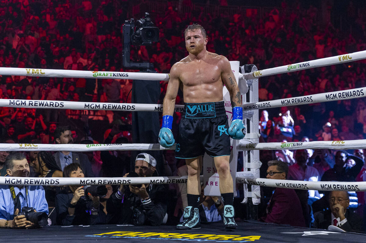 Canelo Alvarez waits to see if Jaime Munguia gets up after sending him to the canvas during the ...