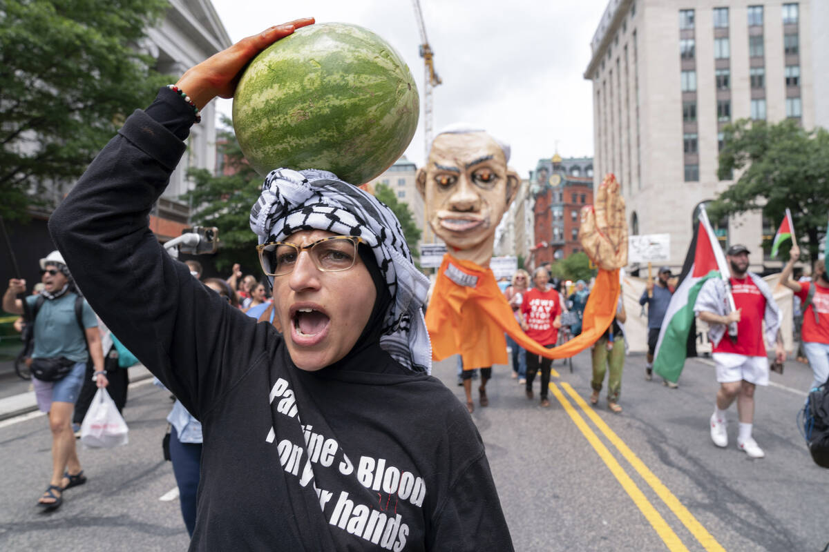 Demonstrators protest the visit of Israeli Prime Minister Benjamin Netanyahu to the White House ...